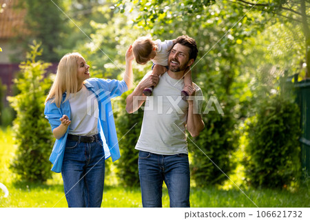 Parents and their cure kid spending time in the park Parents and their cure kid spending time in the park 106621732