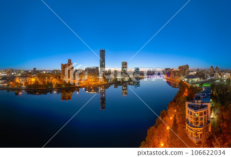 Yekaterinburg city and pond aerial panoramic view at summer or early autumn night. Night city in the early autumn or summer. 106622034