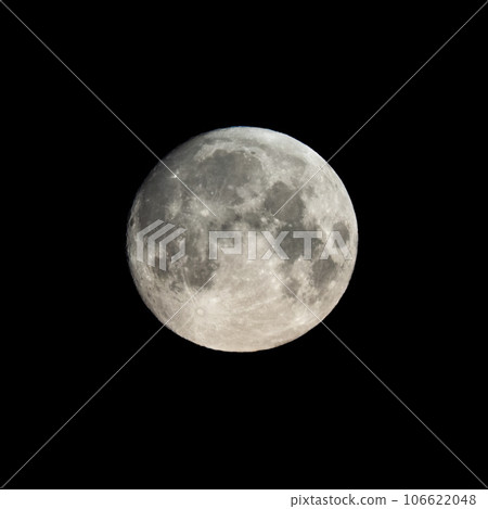 Detailed image of the full moon isolated on black. 106622048