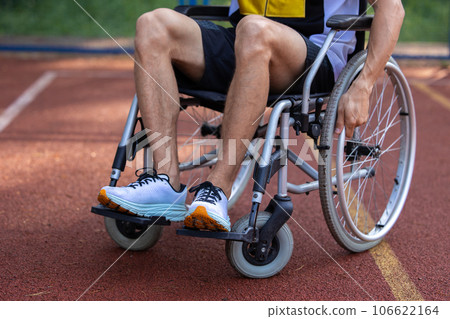 Disabled man in wheelchair at basketball court. 106622164