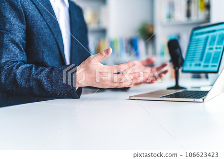 A man having a video conference 106623423