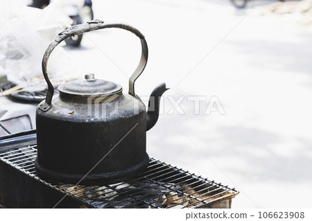 Old kettle used in street food stalls in Hanoi, Vietnam Old kettle used in street food stalls in Hanoi, Vietnam 106623908