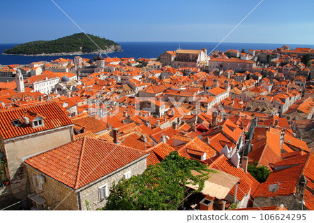 Croatia's world cultural heritage, the pearl of the Adriatic Sea, Dubrovnik - the old town with its bright orange roofs seen from the city walls Croatia's world cultural heritage, the pearl of the Adriatic Sea, Dubrovnik - the old town with its bright orange roofs seen from the city walls 106624295