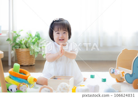 Family girl playing with building blocks Family girl playing with building blocks 106624831