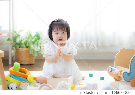 Family girl playing with building blocks Family girl playing with building blocks 106624832