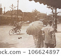 A woman in a kimono walking with a parasol, 1930s Tokyo cityscape 106624897