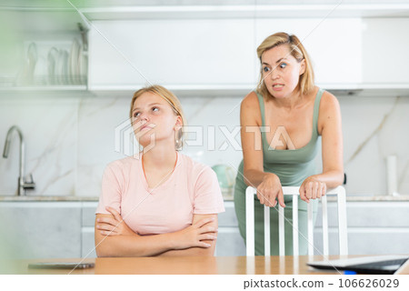 Upset teenage girl forced to listen to reprimands of disgruntled mother Upset teenage girl forced to listen to reprimands of disgruntled mother 106626029