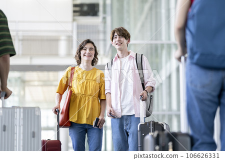 Young foreign men and women with suitcases travel inbound image Young foreign men and women with suitcases travel inbound image 106626331