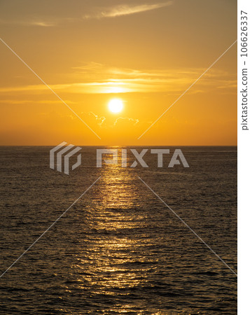 Sunset sky and calm sea (Pacific Ocean). From the coast in Muroto City, Kochi Prefecture in summer (August). (vertical composition) 106626337