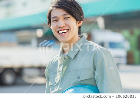Young man in work clothes outdoors 106626835