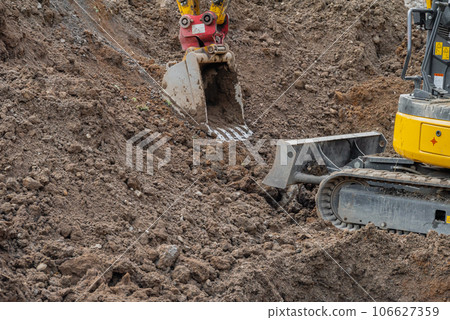 Small heavy machinery used for cutting earth 106627359