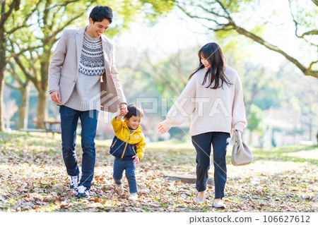 Family playing in the autumn park Family playing in the autumn park 106627612
