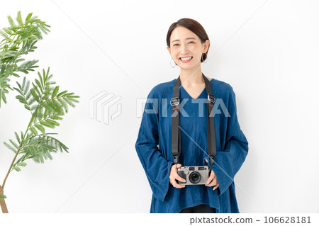 A woman with a camera A woman with a camera 106628181