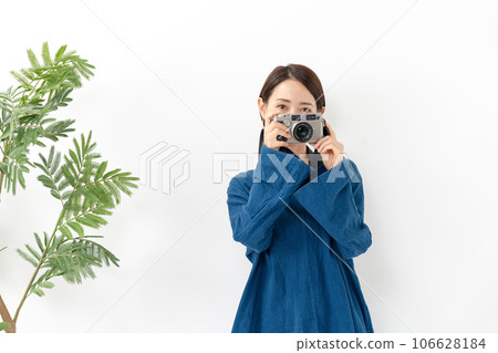 A woman with a camera A woman with a camera 106628184