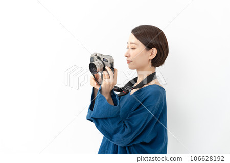 A woman with a camera A woman with a camera 106628192