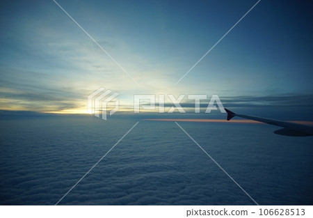 A sea of clouds just before sunset photographed from a passenger plane flying overhead (May 2022) A sea of clouds just before sunset photographed from a passenger plane flying overhead (May 2022) 106628513