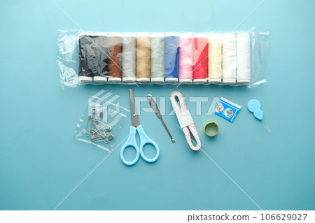 Tools and accessories for sewing on color background  106629027