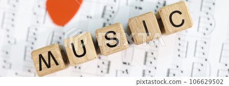 Music word collected from wooden cubes and musical notes 106629502
