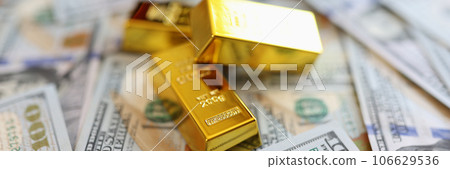 Stack small golden ingots on pots of money cash Stack small golden ingots on pots of money cash 106629536