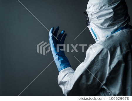 Men in protective clothing for infectious disease control Men in protective clothing for infectious disease control 106629678