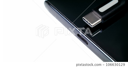 USB Type C cable, Type-C port connector on white background, power charger port of mobile phone. 106630129