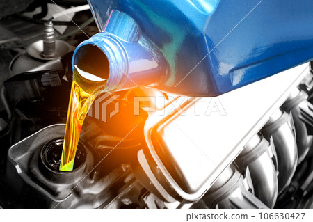 Refueling and pouring oil quality into the engine motor car Transmission and Maintenance Gear .Energy fuel concept. Refueling and pouring oil quality into the engine motor car Transmission and Maintenance Gear .Energy fuel concept. 106630427