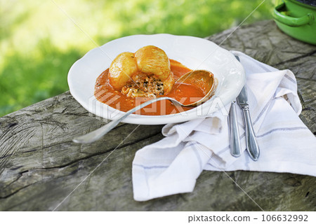 Stuffed peppers in tomato sauce 106632992