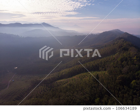 Aerial view mountain sunrise with fog sunrise light morning Aerial view mountain sunrise with fog sunrise light morning 106634189