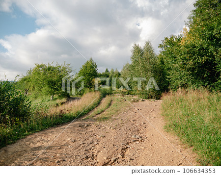 Village in Zakarpattya region with old authentic wooden houses Carpathian mountains view Ukraine Europe. Cottagecore Village in Zakarpattya region with old authentic wooden houses Carpathian mountains view Ukraine Europe. Cottagecore 106634353