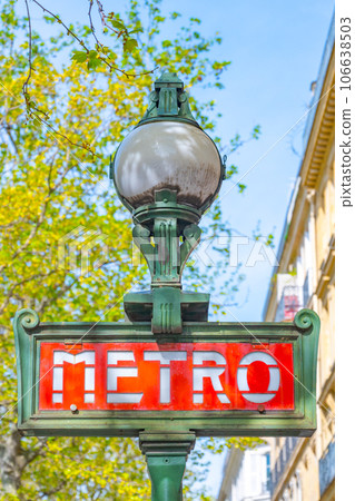 Red metro sign on the traditional green street lamp, Paris, France 106638503