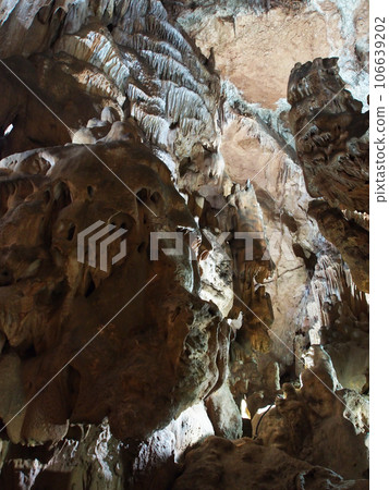 Under the ground. Beautiful view of stalactites and stalagmites in an underground cave-Skelskaya cave, South-West of Crimea. Speleology, the concept of active recreation, extreme travel. Under the ground. Beautiful view of stalactites and stalagmites in an underground cave-Skelskaya cave, South-West of Crimea. Speleology, the concept of active recreation, extreme travel. 106639202