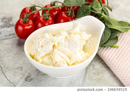 Soft cream cheese in the bowl 106639529