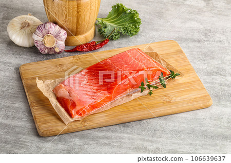 Raw salmon fillet over board Raw salmon fillet over board 106639637