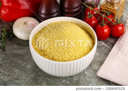 Raw dry wheat couscous grain 106640328