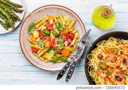Italian pasta adorned with fresh tomatoes and aromatic basil Italian pasta adorned with fresh tomatoes and aromatic basil 106640572