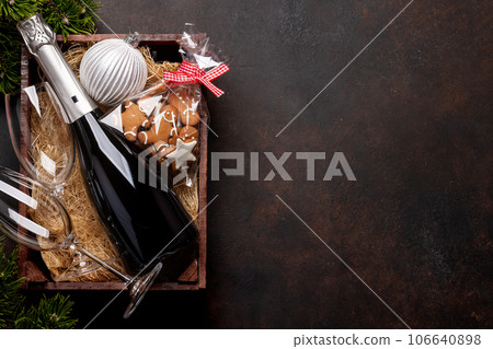 Box with Christmas gingerbread cookies and champagne Box with Christmas gingerbread cookies and champagne 106640898