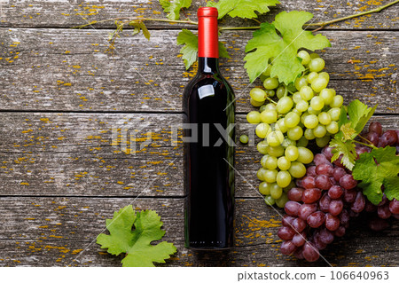 Wine bottle and grape 106640963