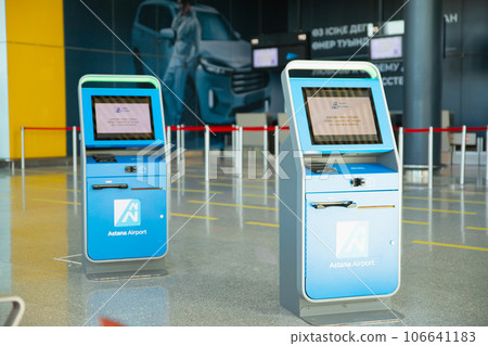 boarding pass printing terminal, self-service transfer machine, airport interior. Astana, Kazakhstan 106641183