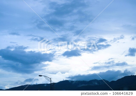 Mysterious clouds, mountains, and street lights 106641629