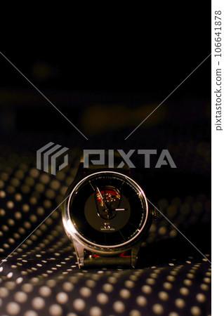 A watch with a black dial and red accents A watch with a black dial and red accents 106641878