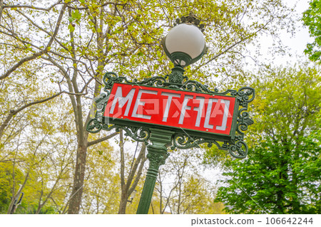Red metro sign on the traditional green street lamp, Paris, France 106642244