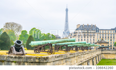 Historical cannons at Les Invalides and parisian cityscape with Eiffel Tower, Paris, France Historical cannons at Les Invalides and parisian cityscape with Eiffel Tower, Paris, France 106642260