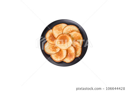 Delicious fresh pancakes on a wooden cutting board with sugar 106644428