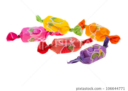 fruit candies in a wrapper isolated fruit candies in a wrapper isolated 106644771