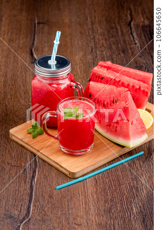 Ripe watermelon smoothie in a glass mug and jar. Ripe watermelon smoothie in a glass mug and jar. 106645650