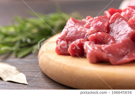 Soft focus on slices of raw beef or lamb meat. 106645656