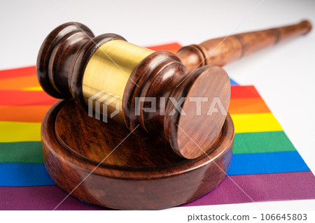Gavel for judge lawyer on rainbow flag, symbol of LGBT pride month celebrate annual in June social of gay, lesbian, bisexual, transgender, human rights. Gavel for judge lawyer on rainbow flag, symbol of LGBT pride month celebrate annual in June social of gay, lesbian, bisexual, transgender, human rights. 106645803