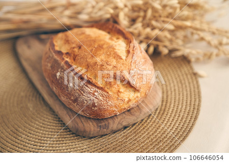 Freshly baked traditional bread. Wheat bakery products on a wooden board with space for copying. High quality photo Freshly baked traditional bread. Wheat bakery products on a wooden board with space for copying. High quality photo 106646054