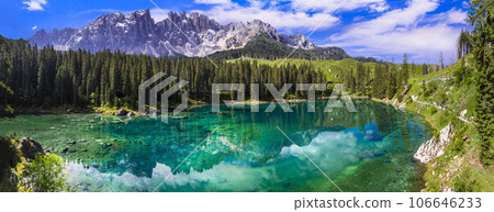 Idyllic nature scenery- turquoise mountain lake Carezza surrounded by Dolomites rocks- one of the most beautiful lakes of Alps. South Tyrol region. Italy 106646233