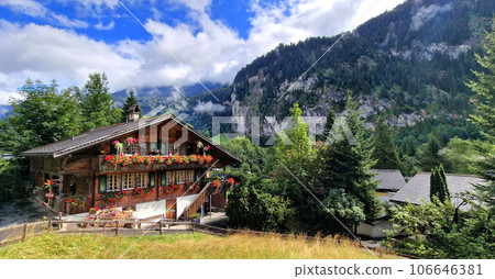 Switzerland travel . most scenic places. beautiful Lauterbrunnen village and valley surrounded by impressive Alps mountains 106646381